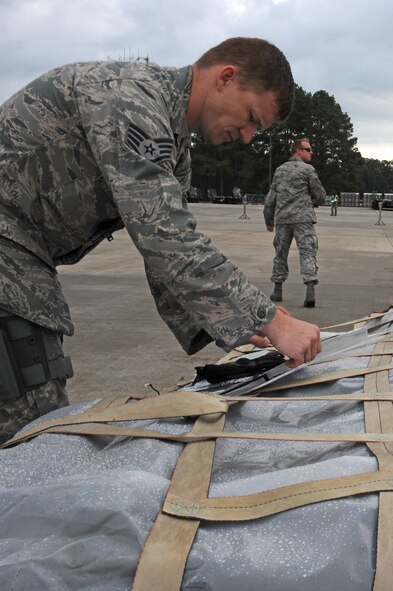 U.S. Air Force Staff Sgt. Jason Caywood, 4th Security Forces Squadron NCO-in charge of supply, checks the handling data of cargo during Phase I of Operational Readiness Exercise Coronet Warrior 12-04 at Seymour Johnson Air Force Base, N.C., Sept. 17, 2012. This data states how Airmen should handle the cargo. (U.S. Air Force photo/Airman 1st Class John Nieves Camacho/Released)