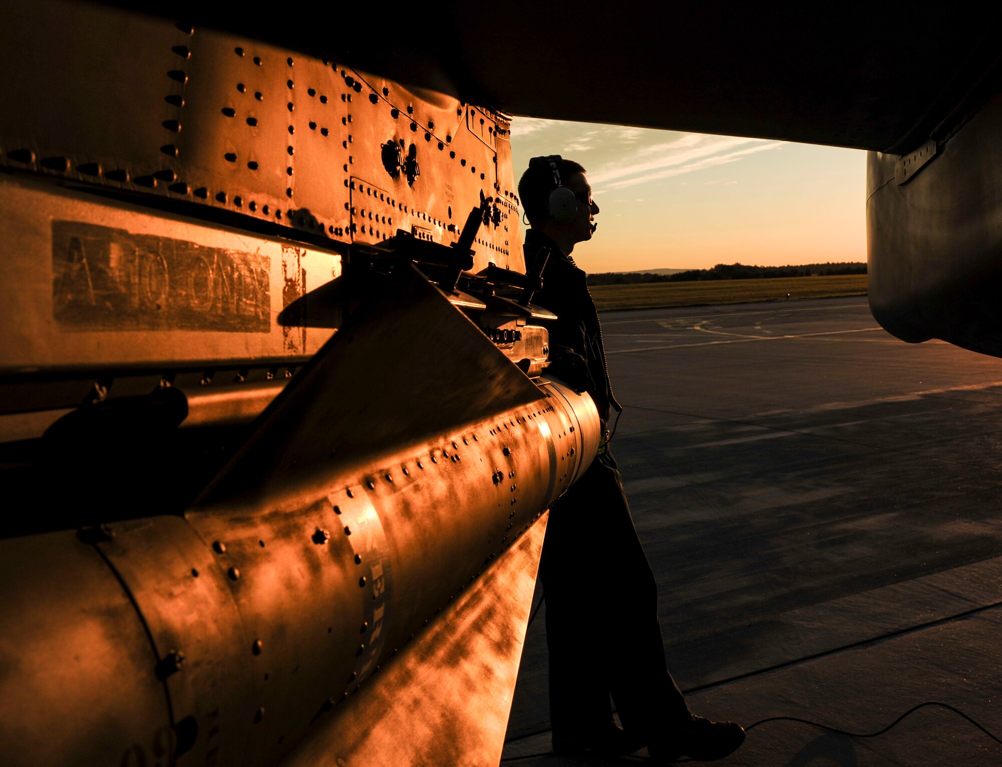 NAMEST AIR BASE, Czech Republic -- A member of the 81st Aircraft Maintenance Unit looks on as A-10 Thunderbolt IIs take off for a close-air-support night mission Sept. 14 during Ramstein Rover 2012 here.  RARO 12 is a NATO exercise focused on preparing forward air controllers for contingency operations. Sixteen NATO member nations are participating in the exercise to establish and build common techniques, tactics and practices. (U.S. Air Force photo by Senior Airman Natasha Stannard/ Released)