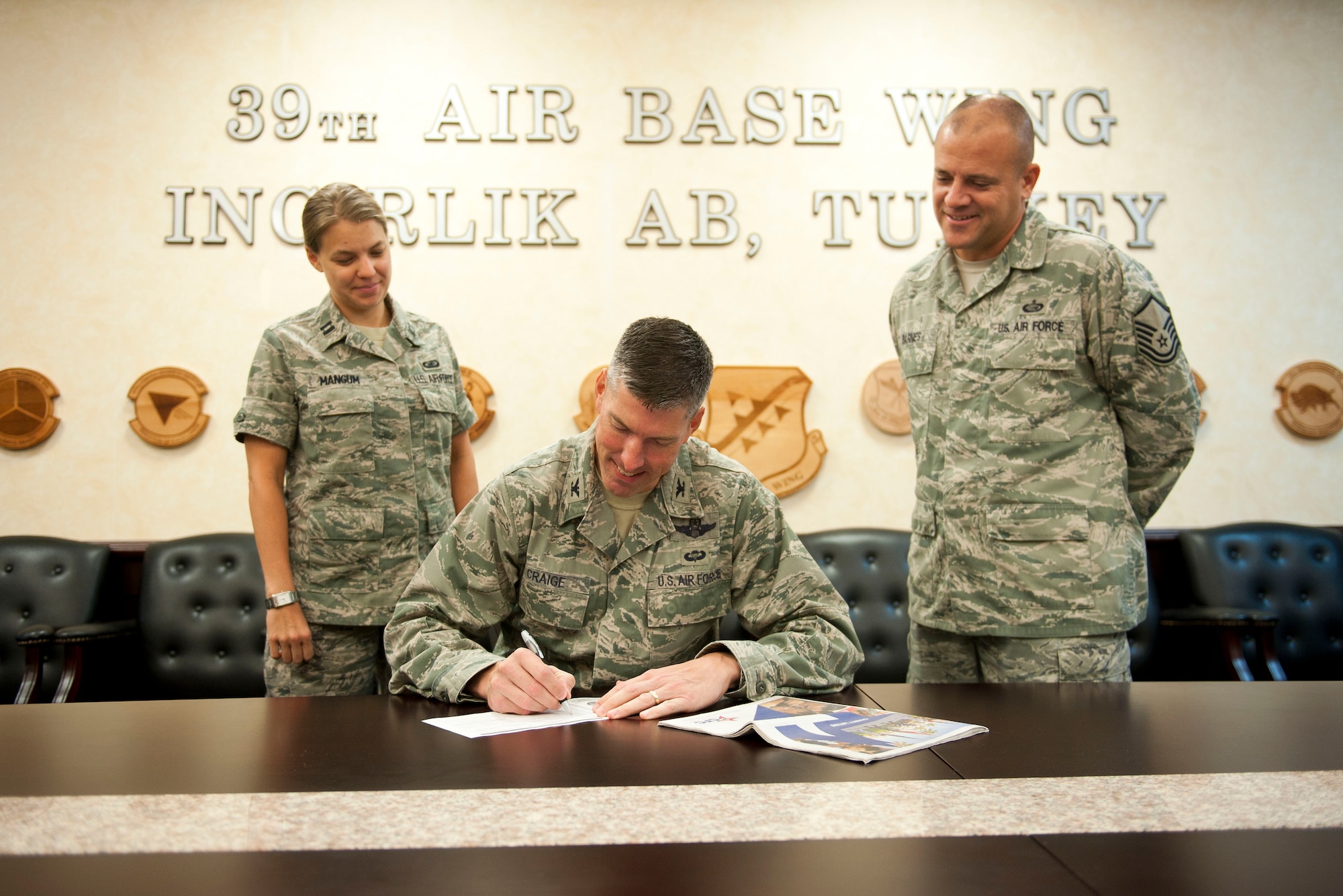 Col. Chris Craige, 39th Air Base Wing commander, makes Incirlik's first Combined Federal Campaign-Overseas donation, Sep. 11, 2012, at Incirlik Air Base, Turkey. The CFC is the only Department of Defense authorized solicitation of federal employees in their workplaces on behalf of approved charitable organizations. In 2011 the overseas campaign raised more than $14 million. (U.S. Air Force photo by Senior Airman Clayton Lenhardt/Released)