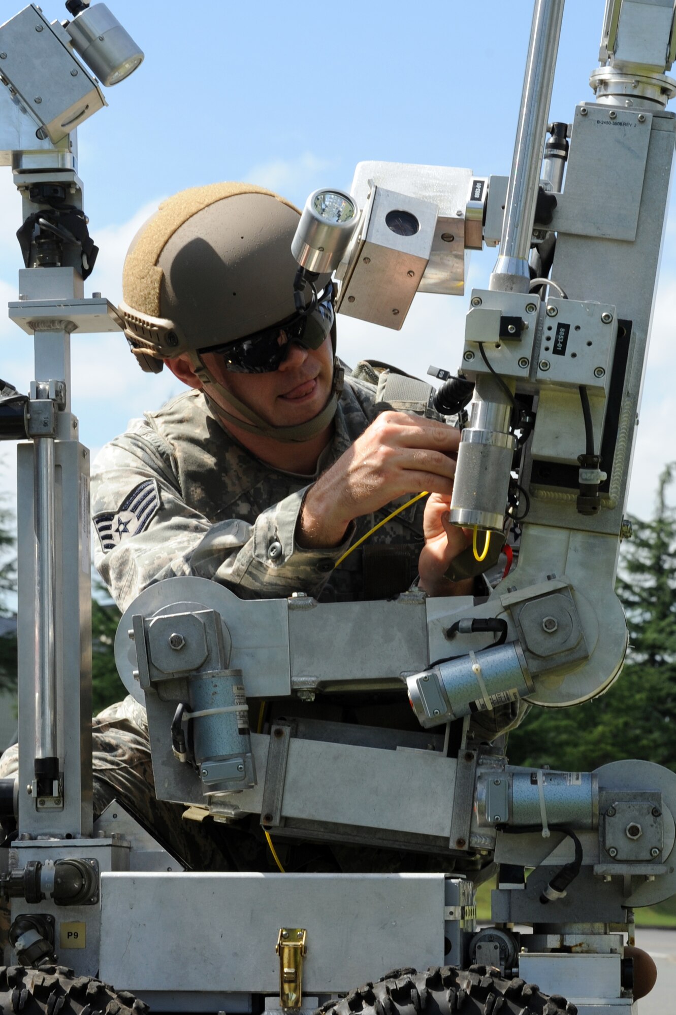 U.S. Air Force Staff Sgt. Ryan Johnson, 35th Civil Engineer Squadron explosive ordnance disposal technician, prepares an EOD robot for use during an Emergency Management Exercise at Misawa Air Base, Japan, Sept. 17, 2012. The use of robots takes EOD Airmen out of dangerous situations. Members of the 35th Fighter Wing conducted the exercise as part of their Combined Unit Inspection. (U.S. Air Force photo by Airman 1st Class Kia Atkins/Released)