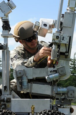U.S. Air Force Staff Sgt. Ryan Johnson, 35th Civil Engineer Squadron explosive ordnance disposal technician, prepares an EOD robot for use during an Emergency Management Exercise at Misawa Air Base, Japan, Sept. 17, 2012. The use of robots takes EOD Airmen out of dangerous situations. Members of the 35th Fighter Wing conducted the exercise as part of their Combined Unit Inspection. (U.S. Air Force photo/Airman 1st Class Kia Atkins)