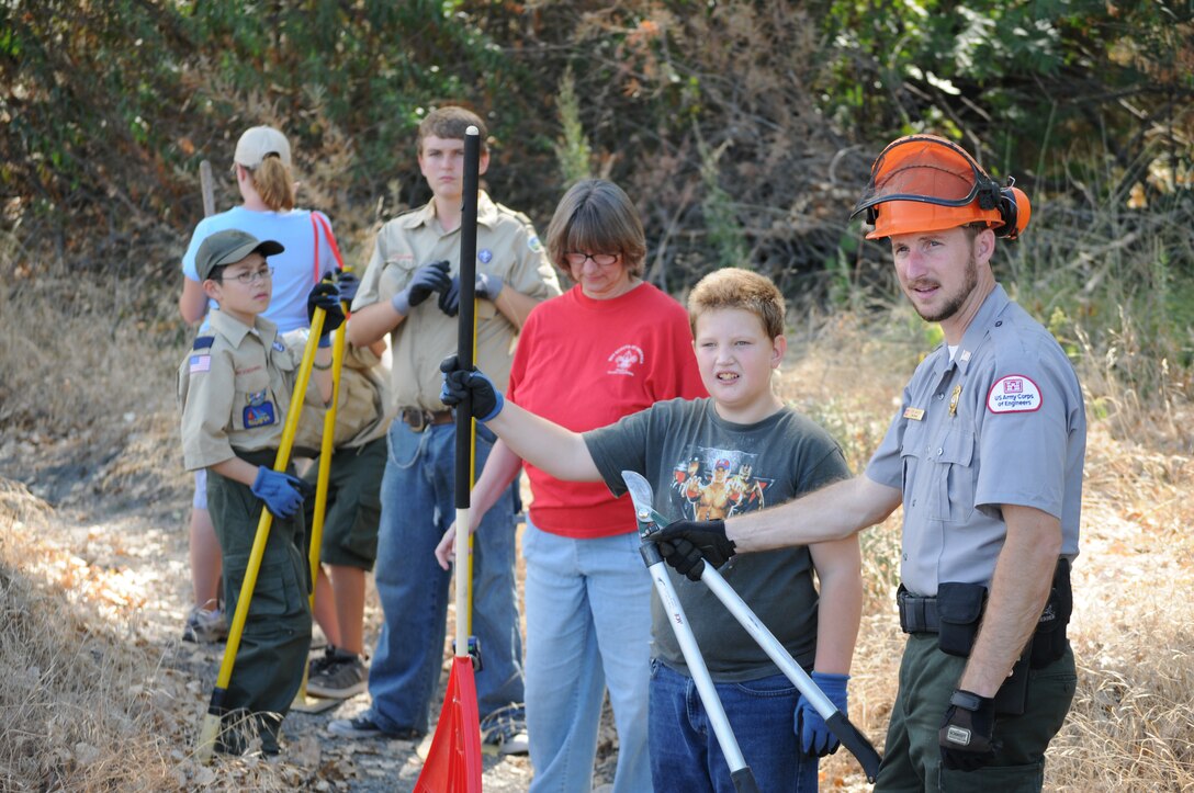 U.S. Army Corps of Engineers park ranger Seth Jantzen (right) and scouts with Boy Scout Troop 4 cleared brush from a hiking trail at Black Butte Lake, Calif., Sept. 24, 2011, in celebration of National Public Lands Day.
