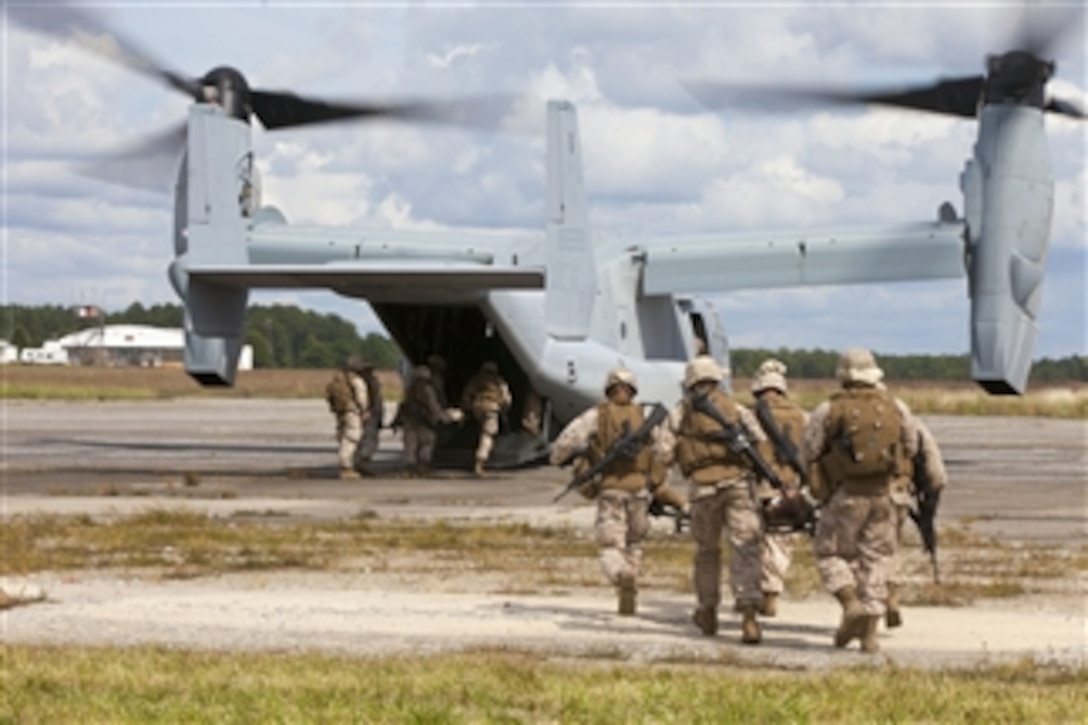 U.S. Marines with Combat Logistics Battalion 26, 26th Marine Expeditionary Unit, rush simulated injured Marines to an MV-22B Osprey during a mass casualty training exercise at Fort Pickett, Va., on Sept. 14, 2012.  The exercise is part of the 26th MEU’s pre-deployment training program.   