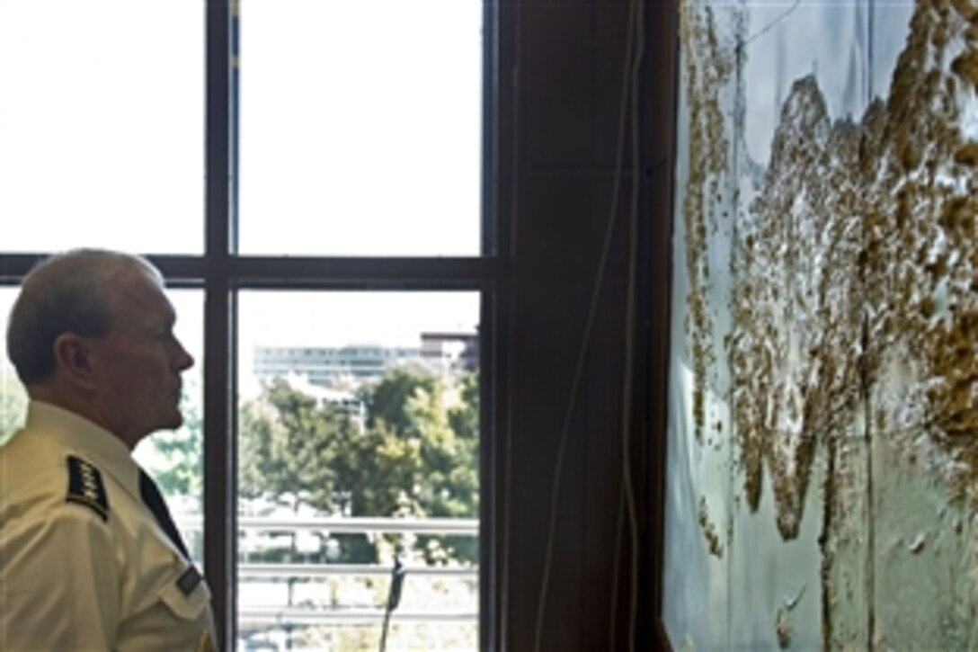 U.S. Army Gen. Martin E. Dempsey, chairman of the Joint Chiefs of Staff, observes a map of Turkey during a visit to Ankara, Turkey, Sept. 17, 2012. 