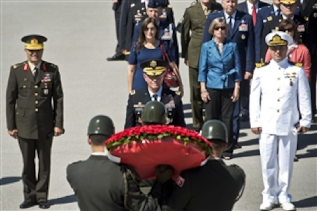 Turkish troops present U.S. Army Gen. Martin E. Dempsey, center, chairman of the Joint Chiefs of Staff, with a wreath at the beginning of his visit to the mausoleum of Kemal Ataturk in Ankara, Turkey, Sept. 17, 2012. 