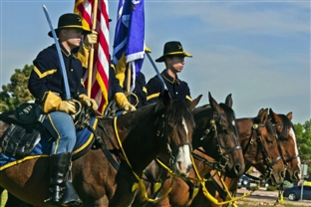 Soldiers from Fort Carson's mounted color guard ride in formation during a ceremony on Fort Carson, Colo., Sept. 15, 2012. The soldiers are assigned to the 440th Civil Affairs Battalion, which has spent the last year filling its ranks with new and veteran civil affairs soldiers. It is now an officially commissioned unit.