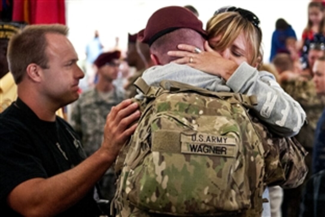 Army Pfc. Jordan Wagner greets loved ones during a homecoming ceremony at Pope Army Airfield on Fort Bragg, N.C., Sept. 9, 2012.