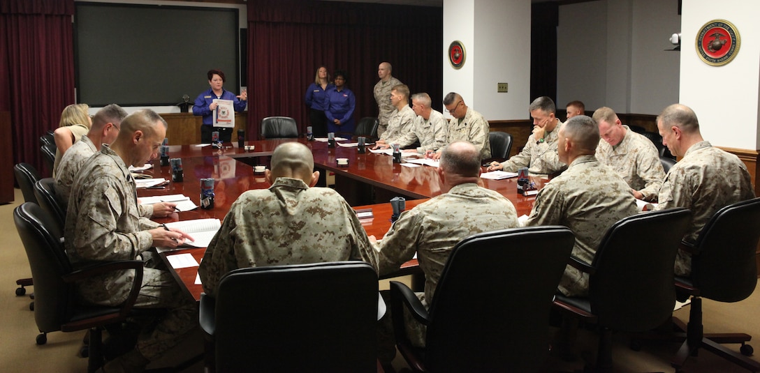 Leaders from across Marine Corps Base Camp Lejeune listen intently for instructions about the Combined Federal Campaign and how to donate aboard Marine Corps Base Camp Lejeune Sept. 14. The CFC is the largest and most successful charity organization in the United States.