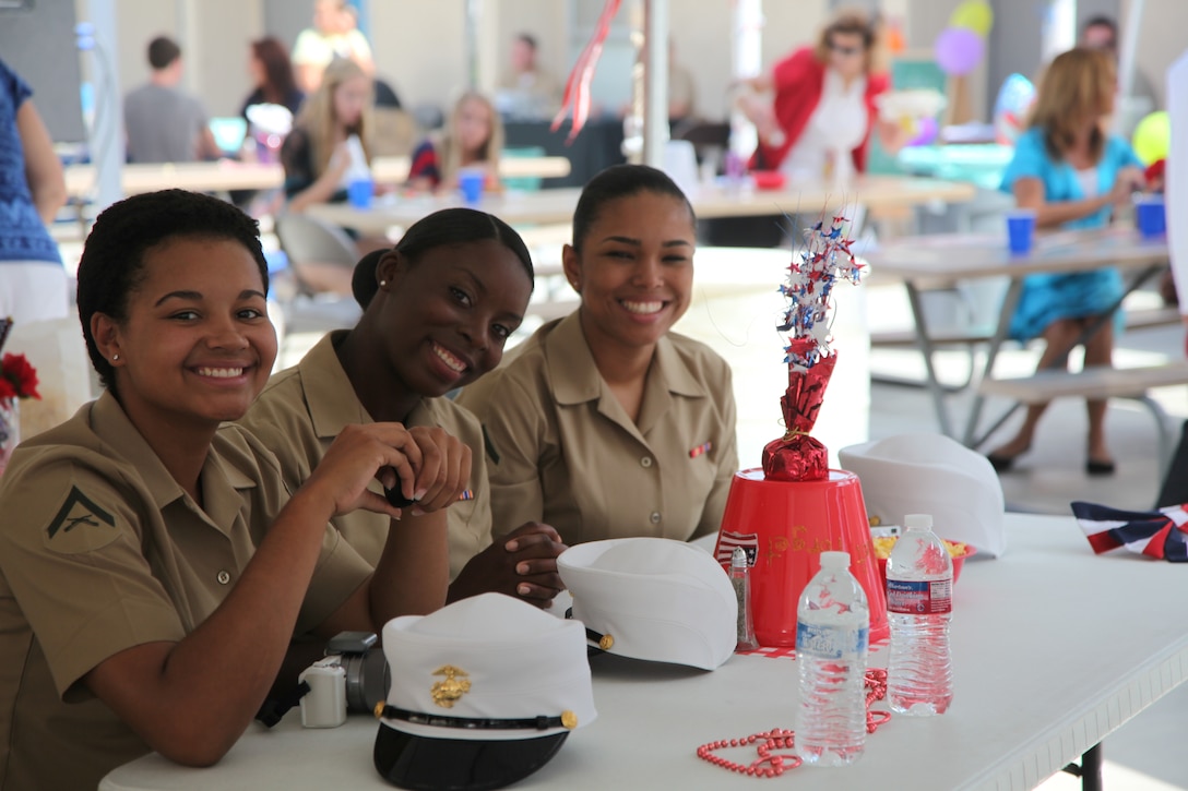 Lance Cpl. Pasha Martin, Lance Cpl. Tylena Murray and Lance Cpl. Sharday Pintolacy, supply clerks, Supply Detachment, Combat Logistics Battalion 13, 1st Marine Logistics Group, participate in a 9/11 remembrance event held at Faith Lutheran Church, Sept. 9.