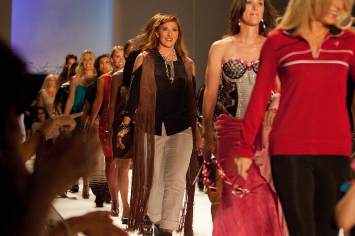NEW YORK -- Gunnery Sgt. Stephanie  Borges, a Rock Island, Ill., native, walks the runway during the "Strut: the fashionable mom" fashion show during Fashion Week NYC, Sept. 10. Borges is the aviation supply chief for Marine Aviation Logistics Squadron 49 and is the mother of four. The show featured ladies who are both business leaders and mothers. (Official Marine Corps photo by Sgt. Randall A. Clinton)