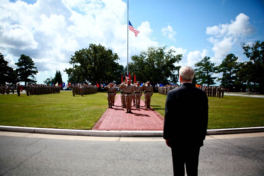 Marines and Sailors of II Marine Expeditionary Force salute while honors are played to Secretary of the Navy, Ray Mabus, aboard Marine Corps Base Camp Lejeune, for 2nd Marine Expeditionary Brigade's Presidential Unit Citation Award Ceremony, Sept. 14. Marines and Sailors of 2nd MEB were awarded for their outstanding performance in action against enemy forces from May 29, 2009 to April 12, 2010 in Afghanistan by Mabus.