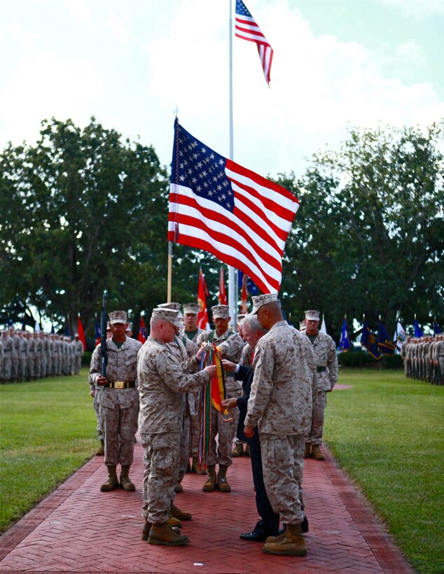 Secretary of the Navy, Ray Mabus awards the Marines and Sailors of 2nd Marine Expeditionary Brigade with a Presidential Unit Citation in honor of their action against enemy forces from May 29, 2009 to April 12, 2010 in Afghanistan. Maj. Gen. Lawrence D. Nicholson, Deputy Chief of Staff, Operations, International Security Force, Afghanistan, and Sgt. Maj. Ernest K. Hoopii, Sergeant Major, Marine Corps Installations East, deployed with 2nd MEB for a year to southern Afghanistan and represented the unit during the ceremony.