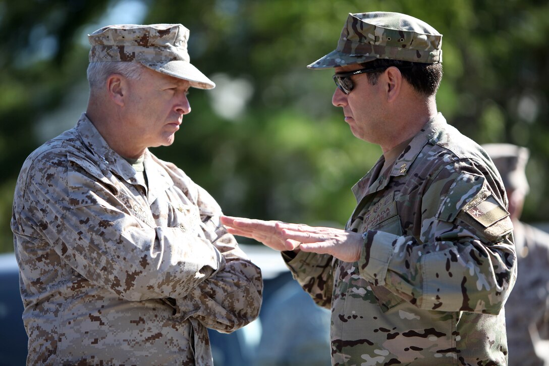 Rear Adm. Marco Amigo Jimenez, general commandant of the Chilean Marine Corps, talks with Major Gen. John Croley after touring the Special Operations Training Group facilities at Stone Bay during his day-long visit to Marine Corps Base Camp Lejeune Sept. 13. Croley, the commanding general of Marine Corps Forces Southern Command, facilitate the trip to showcase the Marine Corps' urban training environments.