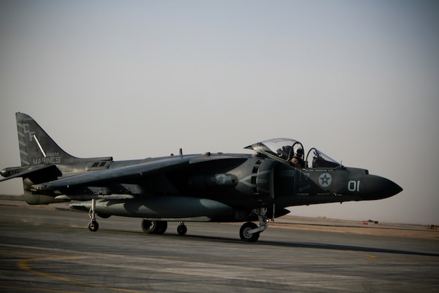 Capt. Matthew Pasquali, a pilot with Marine Attack Squadron 211, 3rd Marine Aircraft Wing (Forward), maneuvers his AV-8B Harrier II Plus into a parking spot, Sept. 18. The squadron operates throughout Helmand and Nimroz province. They are part of the fixed wing attack asset of the Marine Air-Ground Task Force.