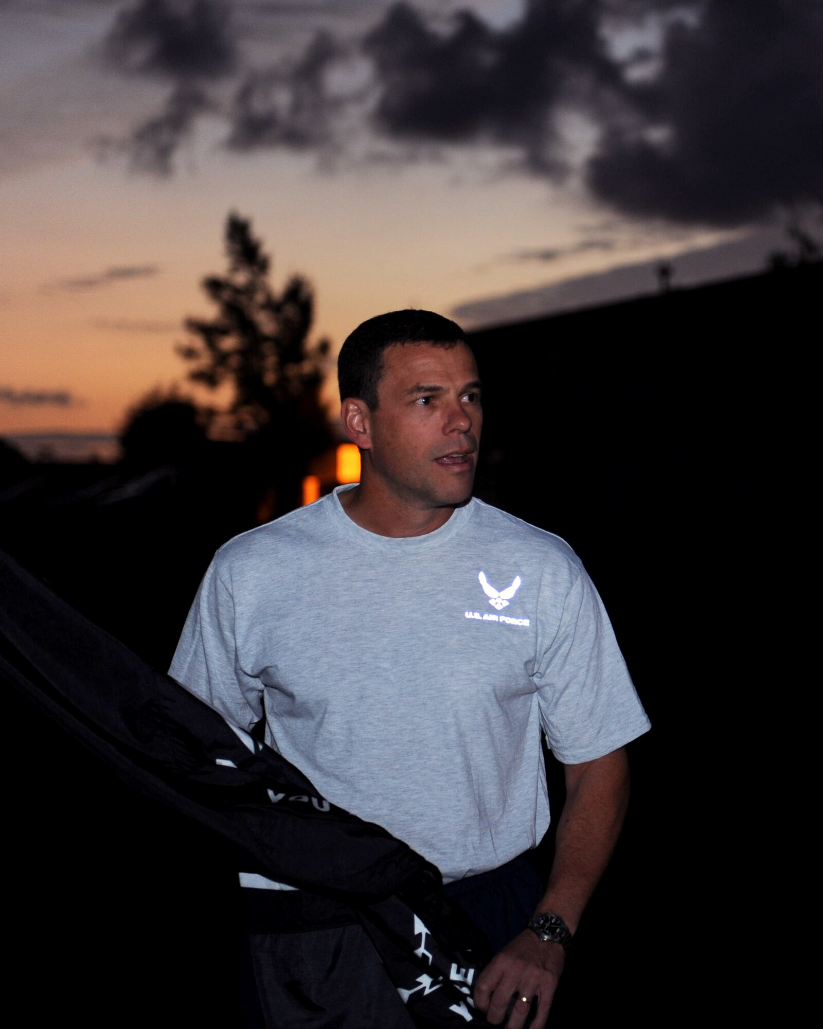 U.S. Air Force Brig. Gen. Matt Molloy, 18th Wing commander, speaks to members of Kadena while holding the Prisoners of War/Missing in Action flag about the POW/MIA Vigil run on Kadena Air Base, Japan, Sept. 20, 2012. Kadena Airmen were up early to start off the 24-hour run that will end on Sept. 21 at 6 a.m., followed by a flag ceremony at the 18th Wing Headquarters, Bldg. 10 at 6:30 a.m. The vigil run is in honor of National POW/MIA Recognition day, held on the 21st. (U.S. Air Force photo/Airman 1st Class Hailey R. Davis)