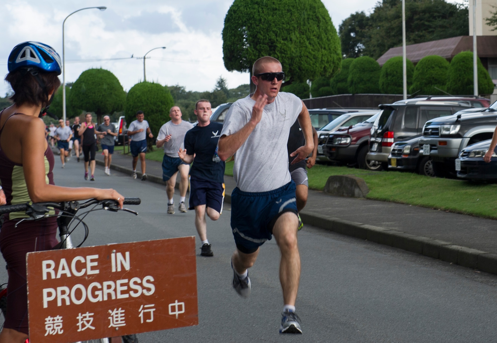 YOKOTA AIR BASE, Japan -- Yokota Airmen race to the finish line during the Combined Federal Campaign - Overseas 5K run Sept. 17, 2012, at Yokota Air Base, Japan.  The CFC-O is an annual fundraising opportunity, which offers millions of federal employees and service members the opportunity to contribute to thousands of eligible non-profit organizations. The CFC-O began Sept. 17 and will continue through Nov. 17. (U.S. Air Force photo by Senior Airman Andrea Salazar)