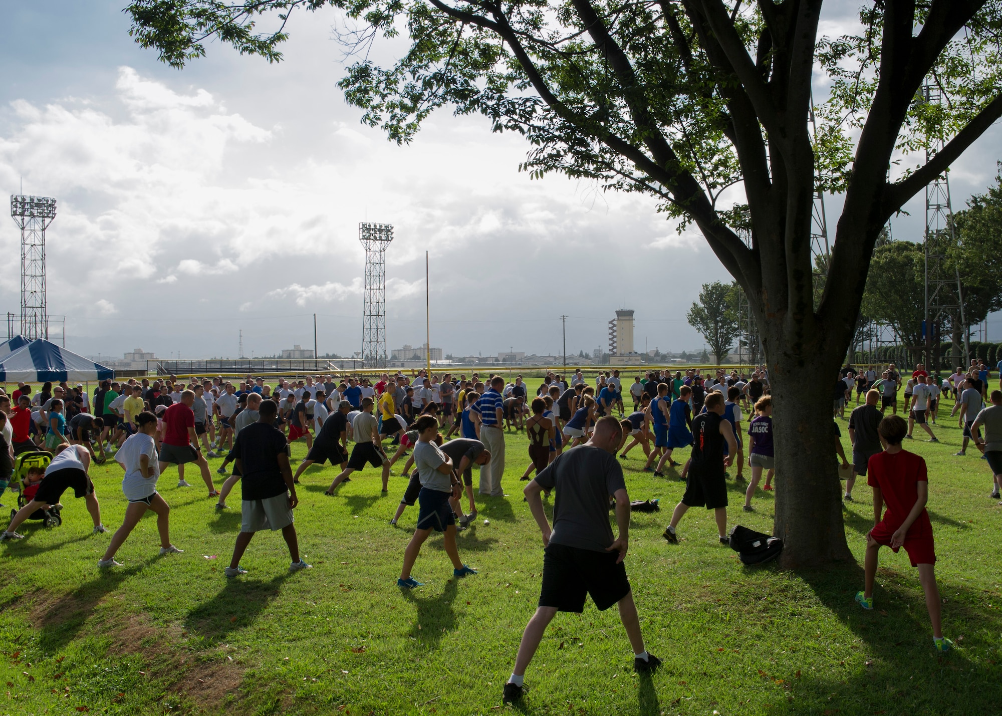 YOKOTA AIR BASE, Japan -- Yokota members stretch before the start of the Combined Federal Campaign - Overseas 5K run Sept. 17, 2012, at Yokota Air Base, Japan. The CFC-O is an annual fundraising drive that allows federal civilian, military and postal employees to donate money to more than 2,500 charitable organizations. (U.S. Air Force photo by Senior Airman Andrea Salazar)