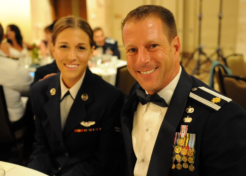 Maj. Jeffrey Holley, Pacific Air Forces A7K chief of strategic integration, and his daughter Airman 1st Class Samantha Holley, a C-17 loadmaster with the 535th Airlift Squadron, pose for a photo during the Joint Base Pearl Harbor-Hickam 65th Air Force Ball, held at the Hilton Hawaiian Village Sept. 14, 2012.  Maj. Holley invited his daughter as his date to the ball shortly after discovering that he would be stationed at JBPH-H, Hawaii with her. (U.S. Air Force photo/Tech. Sgt. Jerome S. Tayborn)