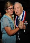 Mrs. Cass Gannaway and her cousin, Durward Swanson, dance and enjoy the music provided by the U.S. Air Force Band of the Pacific’s Hana Hou at the Joint Base Pearl Harbor-Hickam 65th Air Force Ball held at the Hilton Hawaiian Village Sept. 14, 2012.  Swanson is a Hickam Field Survivor of the Dec. 7, 1941, attacks on Oahu and served as the guest of honor. He participated in the symbolic cake cutting, which involves the youngest and oldest Airmen attendees cutting the cake. Swanson was a U.S. Army Air Corps motorcycle patrolman at Hickam when the Japanese attacked the bases here 70 years ago. Swanson and his best friend Albert Lloyd recovered the tattered U.S. flag now known as Old Glory, after the attacks. The flag is on display in the Courtyard of Heroes at the Pacific Air Forces headquarters building. (U.S. Air Force photo/Tech. Sgt. Jerome S. Tayborn)