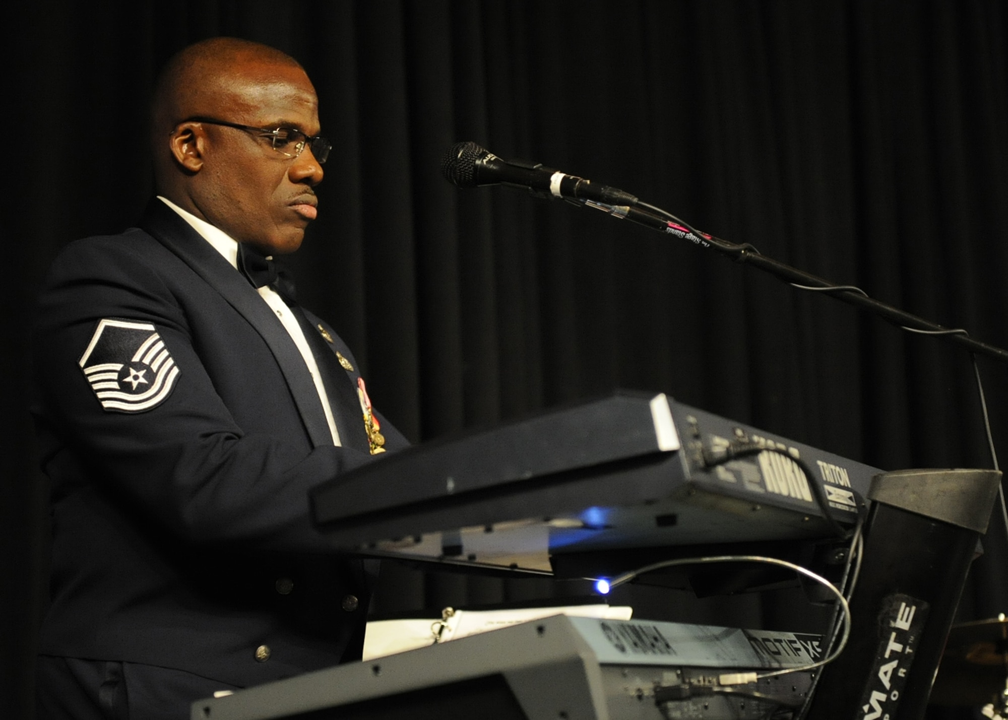 Master Sgt. Darryl McEachin from the U.S. Air Force Band of the Pacific’s Hana Hou performs a musical piece on his electronic keyboard during the Joint Base Pearl Harbor-Hickam 65th Air Force Ball at Hilton Hawaiian Village Sept. 14, 2012. More than 1,300 Joint Base Pearl Harbor Hickam members came together to celebrate the Air Force's 65th anniversary. This year’s theme was, “Say ‘Thank You’ to an Airman,” honoring the courage and service of Airmen throughout the decades. (U.S. Air Force photo/Tech. Sgt. Jerome S. Tayborn)