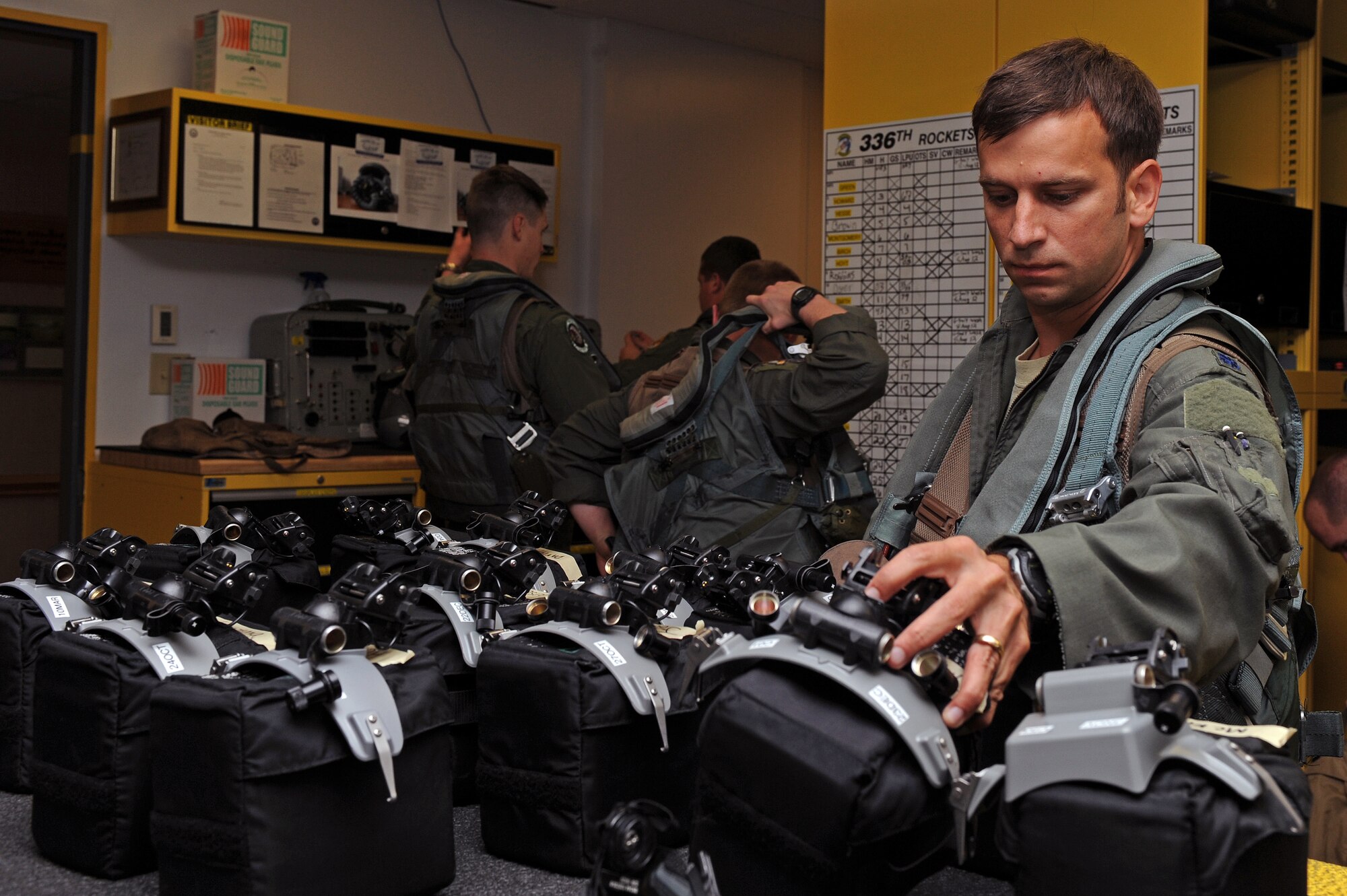 U.S. Air Force Lt. Col. Jesse Smith, 336th Fighter Squadron assistant director of operations, takes night vision goggles to prepare for flight during Phase II of Operational Readiness Exercise Coronet Warrior 12-04 at a simulated deployed location on Seymour Johnson Air Force Base, N.C., Sept. 19, 2012. NVGs allow increased visibility for aircrew during night flying operations. (U.S. Air Force photo/Airman 1st Class John Nieves Camacho/Released)