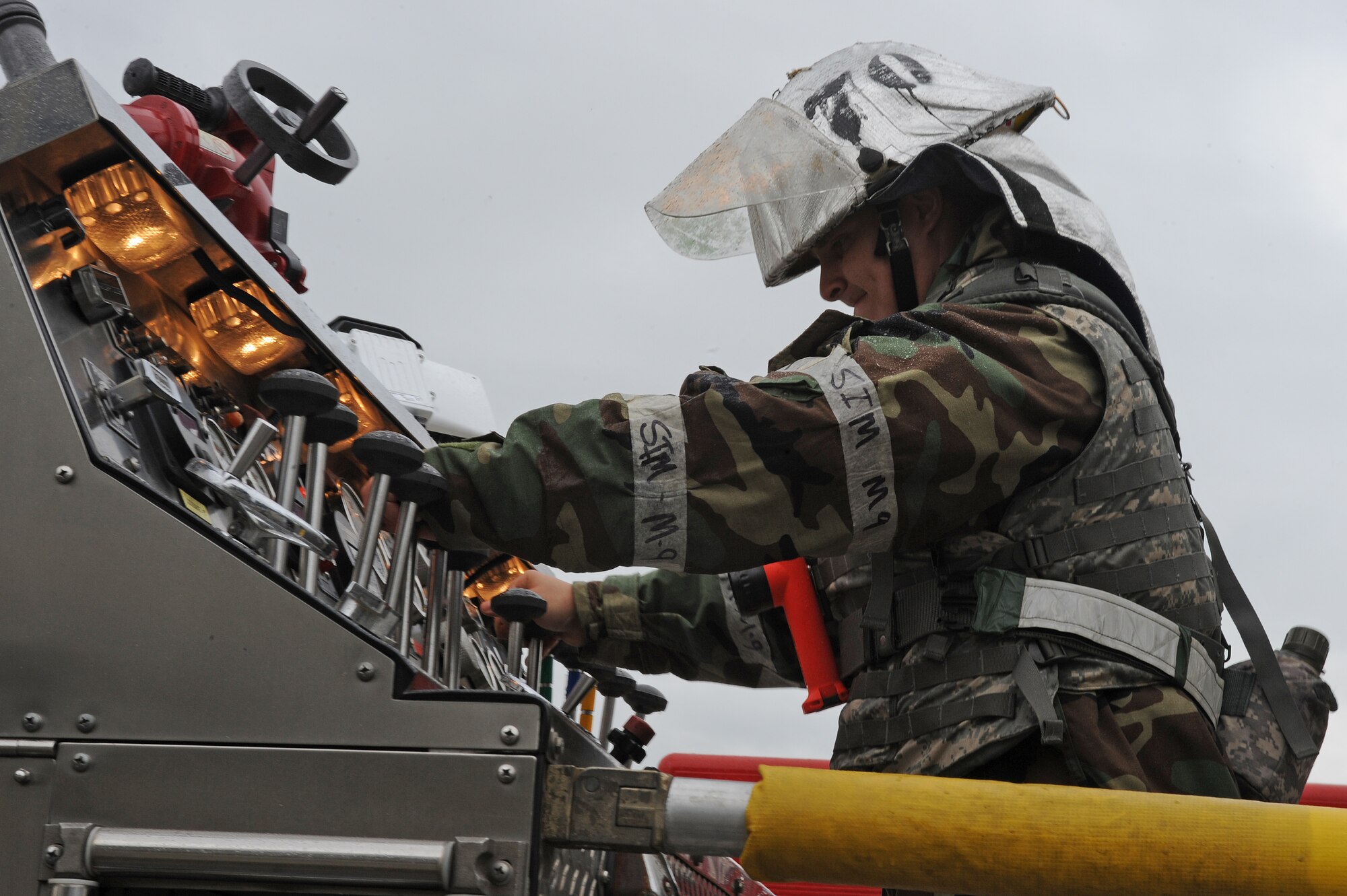 U.S. Air Force Senior Airman Anthony Hilderbrand, 4th Civil Engineer Squadron driver/operator, operates the pump panel to control water pressure during Phase II of Operational Readiness Exercise Coronet Warrior 12-04 at a simulated deployed location on Seymour Johnson Air Force Base, N.C., Sept. 19, 2012. The pump panel controls the amount and rate of water that is distributed. (U.S. Air Force photo/Airman 1st Class John Nieves Camacho/Released)