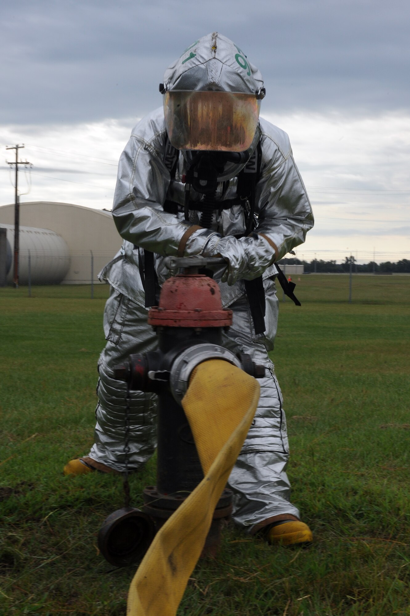 U.S. Air Force Airman 1st Class Benton Vandergrift, 4th Civil Engineer Squadron firefighter, releases water from a fire hydrant during Phase II of Operational Readiness Exercise Coronet Warrior 12-04 at a simulated deployed location on Seymour Johnson Air Force Base, N.C., Sept. 19, 2012. OREs test an Airman's ability to operate in a contested environment. (U.S. Air Force photo/Airman 1st Class John Nieves Camacho/Released)