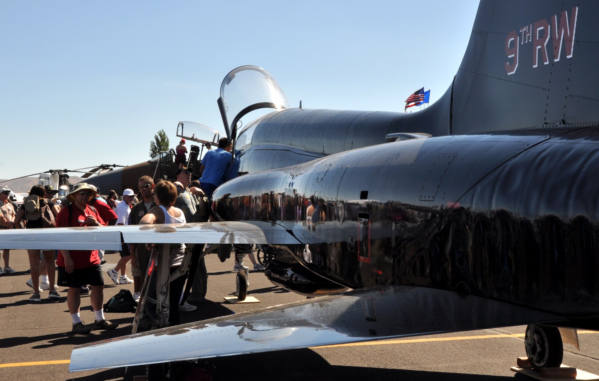 Air show spectators tour an Air Force T-38 Talon trainer aircraft during the National Championship Air Races at Stead Airport, Reno, Nev., Sept. 14, 2012. The aircraft is assigned to the 9th Reconnaissance Wing, Beale Air Force Base, Calif. (U.S. Air Force photo by Staff Sgt. Robert M. Trujillo/Released)