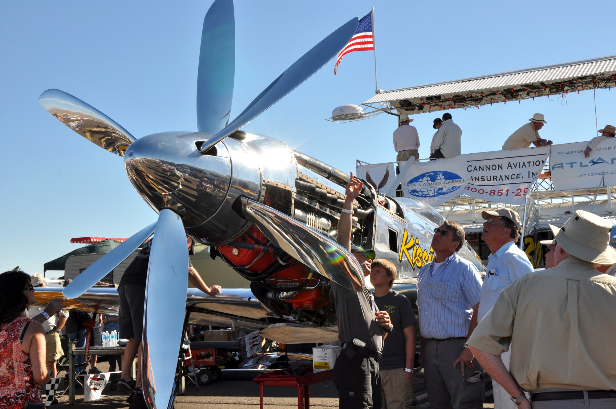 A pilot explains propeller modifications to his P-51 Mustang fighter aircraft during the National Championship Air Races at Stead Airport, Reno, Nev., Sept. 14, 2012. The air races have been held annually since 1963. (U.S. Air Force photo by Staff Sgt. Robert M. Trujillo/Released)