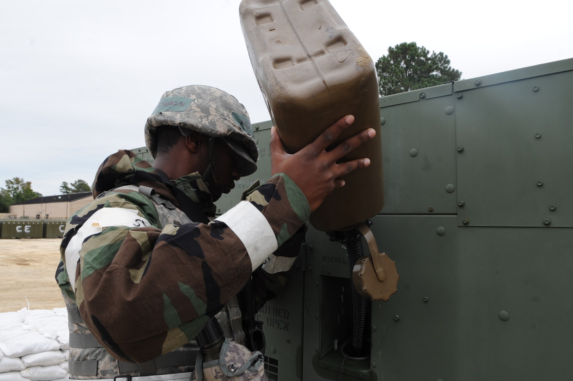 U.S. Air Force Airman 1st Class Devariel McLaurin, 4th Civil Engineer Squadron power production technician, fills a generator with diesel fuel during Operational Readiness Exercise Coronet Warrior 12-4 at a simulated deployed location on Seymour Johnson Air Force Base, N.C., Sept. 19, 2012. The generator must stay fueled in order to contribute to the continuance of the base's operations. (U.S. Air Force photo/Airman 1st Class Aubrey Robinson/Released)