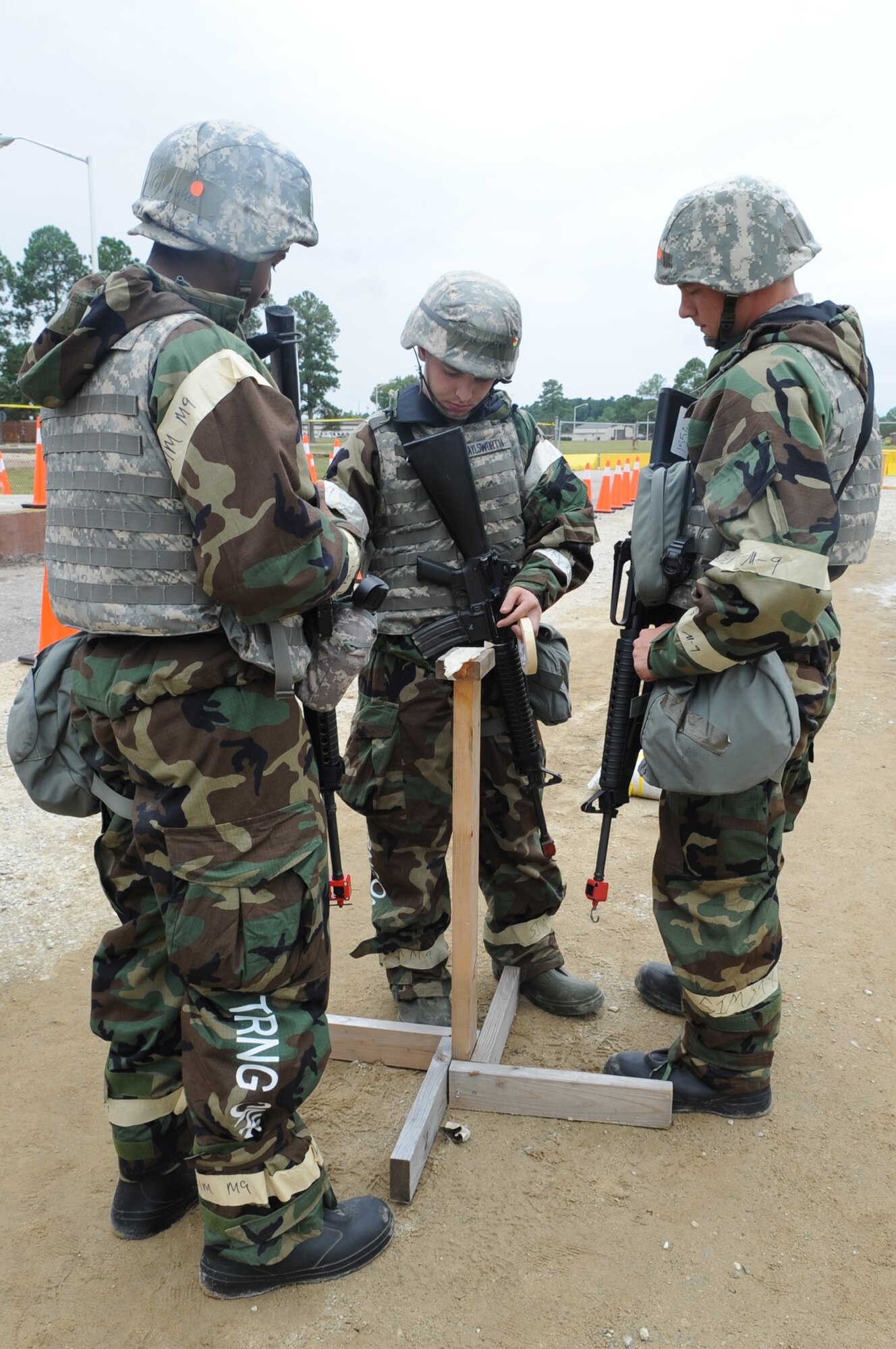 U.S. Air Force Airmen assigned to the 4th Fighter Wing check simulated M-8 paper during Operational Readiness Exercise Coronet Warrior 12-4 at a simulated deployed location on Seymour Johnson Air Force Base, N.C., Sept. 19, 2012. The paper is typically reviewed and changed after each attack and shift change. (U.S. Air Force photo/Airman 1st Class Aubrey Robinson/Released)