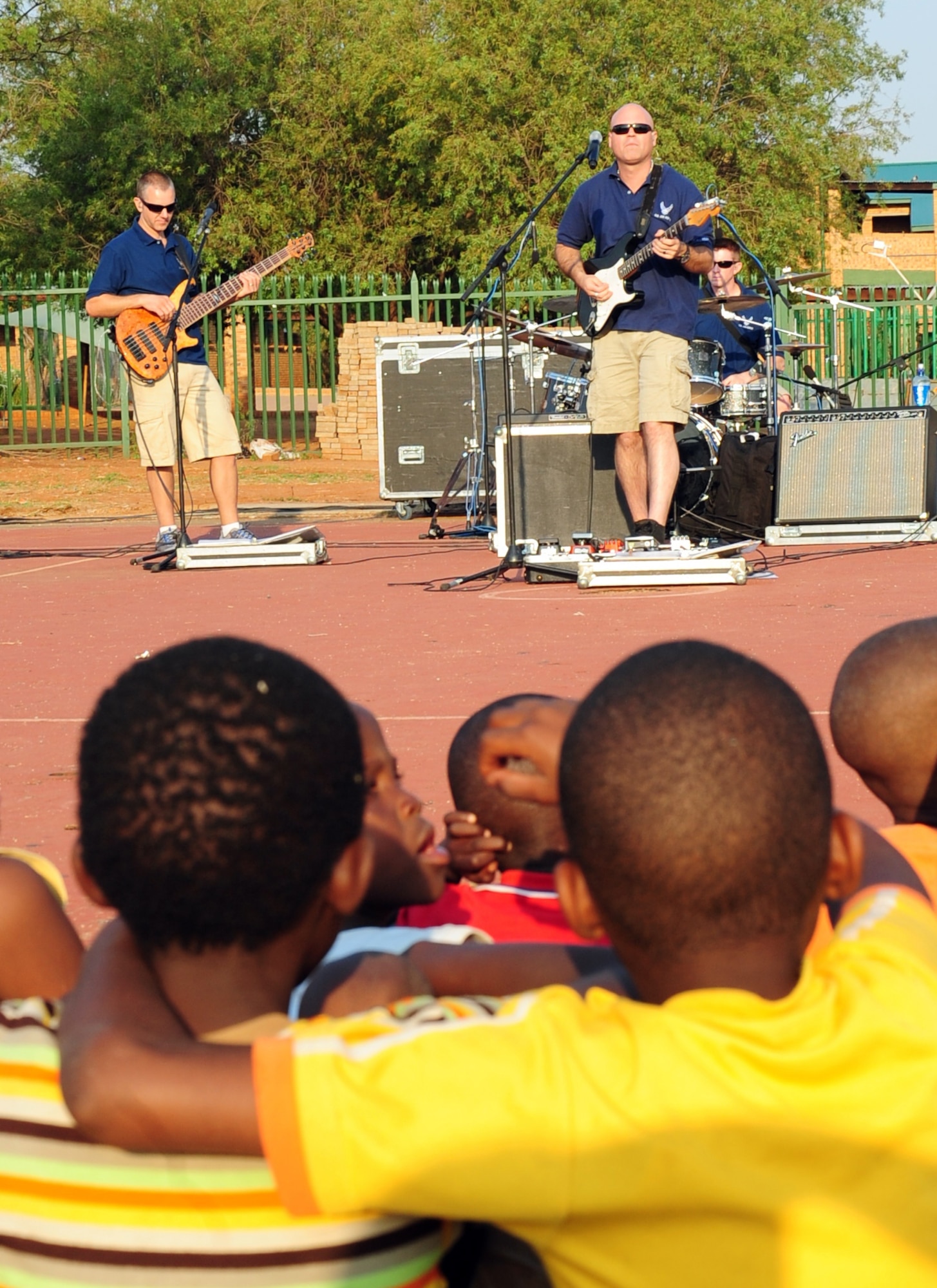 CULLINAN, South Africa -- The U.S. Air Forces in Europe rock band, Touch 'n Go, performs a concert as children from the local community watch here, Sept. 18. Touch ‘n Go is here as part of a group of Soldiers, Sailors, Airmen and Marines supporting the Africa Aerospace and Defense Trade show at Air Force Base Waterkloof from Sept. 19-23. As part of their stay, the band visited local communities strengthening the partnership between South Africa and the United States. (U.S. Air Force photo by Staff Sgt. Debbie Lockhart)