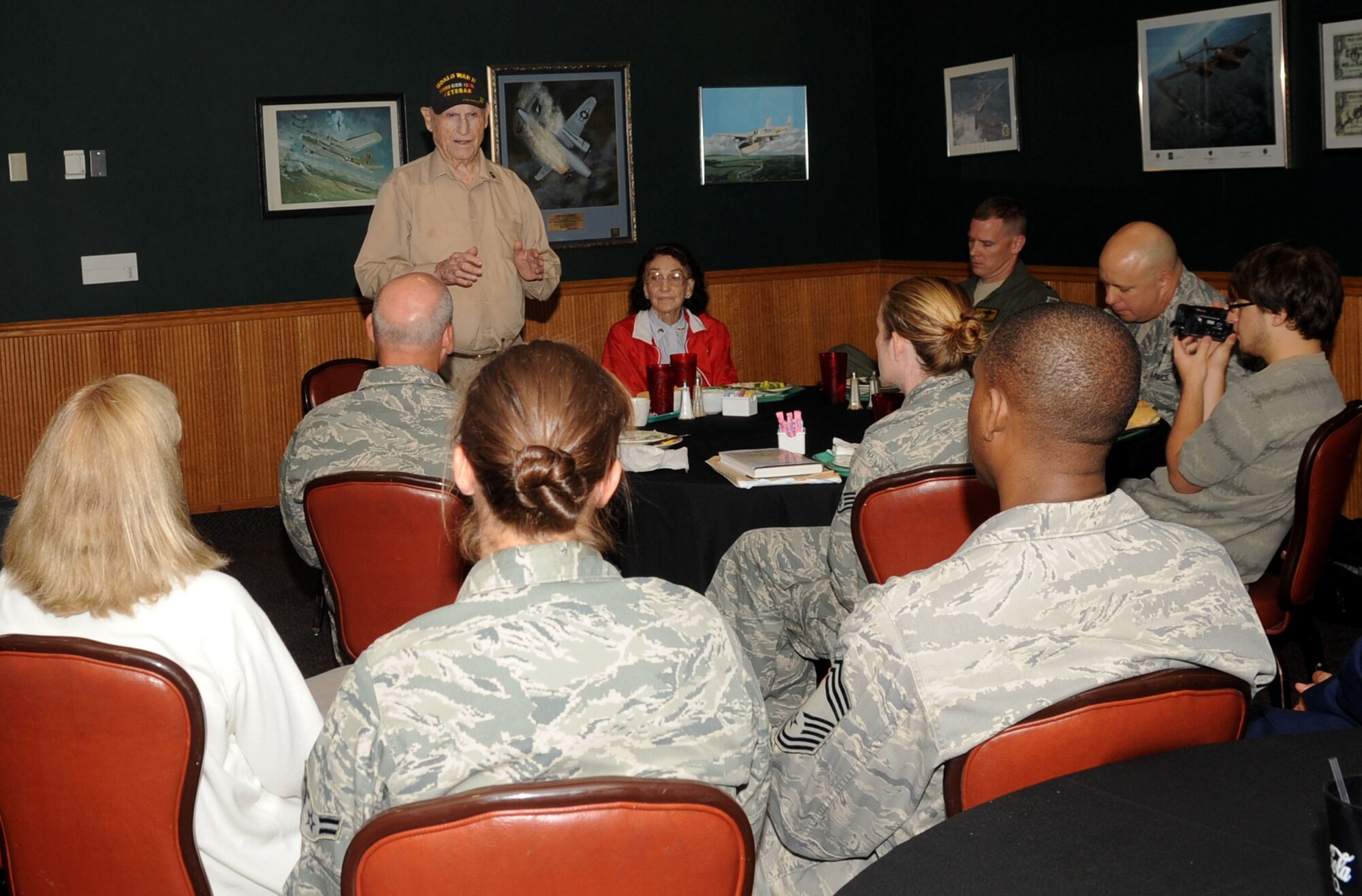 Claude McCrocklin, an Army Air Corps bombardier, speaks to members of Team Barksdale during an informal luncheon on Barksdale Air Force Base, La., Sept. 19. McCrocklin spoke about his military service during World War II and his time as a Prisoner of War. (U.S. Air Force photo/Senior Airman Kristin High)(RELEASED)
