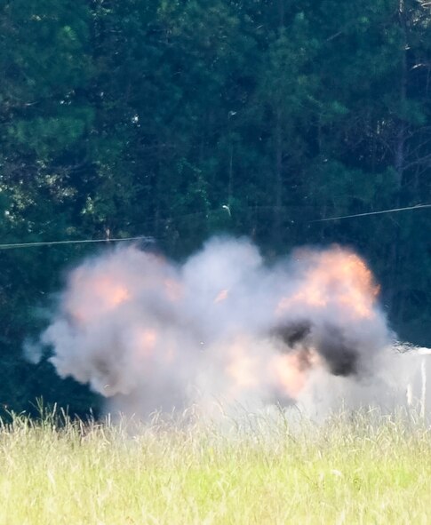 Explosive charges detonate during an explosive ordnance disposal (EOD) demonstration conducted by the 116th Civil Engineering Squadron (CES) explosive ordnance unit at Robins Air Force Base, Ga., Sept. 19, 2012.  During the demonstration, EOD technicians from the 116th CES set off several explosive charges downrange while explaining the process to local media that attended the event. (National Guard photo by Master Sgt. Roger Parsons/Released)