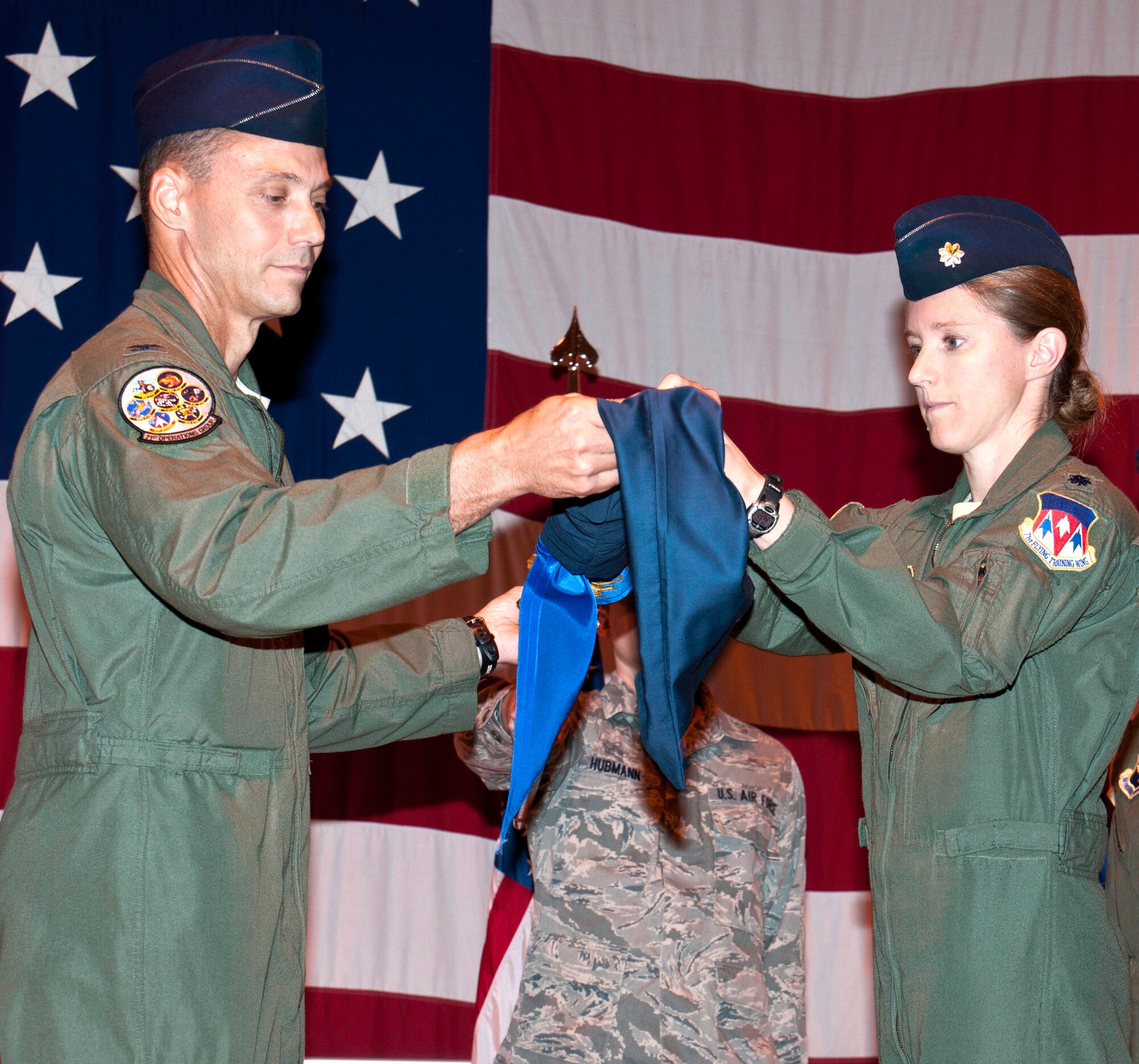 Col. James Abatti, left, the 71st Operations Group commander, and Lt. Col. Michelle Pryor, commander of the newly reactivated 3rd Flying Training Squadron, uncase the 3rd FTS guidon during a ceremony held Sept. 14 in Hangar 170 at Vance AFB, Okla. The unit, known as the 32nd Flying Training Squadron prior to the ceremony, trains student pilots at Vance AFB to fly the T-1A Jayhawk. (U.S. Air Force photo/ Terry Wasson)