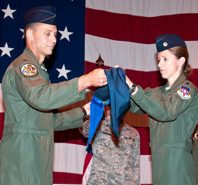 Col. James Abatti, left, the 71st Operations Group commander, and Lt. Col. Michelle Pryor, commander of the newly reactivated 3rd Flying Training Squadron, uncase the 3rd FTS guidon during a ceremony held Sept. 14 in Hangar 170 at Vance AFB, Okla. The unit, known as the 32nd Flying Training Squadron prior to the ceremony, trains student pilots at Vance AFB to fly the T-1A Jayhawk. (U.S. Air Force photo/ Terry Wasson)