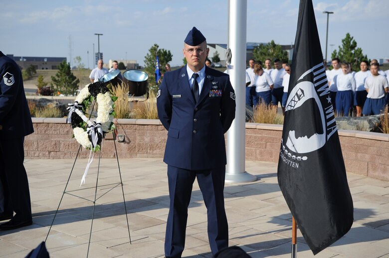 BUCKLEY AIR FORCE BASE, Colo. – Staff Sgt. Coleman Powell, 460th Operations Support Squadron, stands at parade rest during a retreat ceremony held Sept. 17, 2012, to honor prisoners of war and those missing in action. The base observed National POW/MIA Recognition Day with events that also included a 12-hour wreath guard detail and a multiservice remembrance march. (U.S. Air Force photo by Airman 1st Class Phillip Houk)