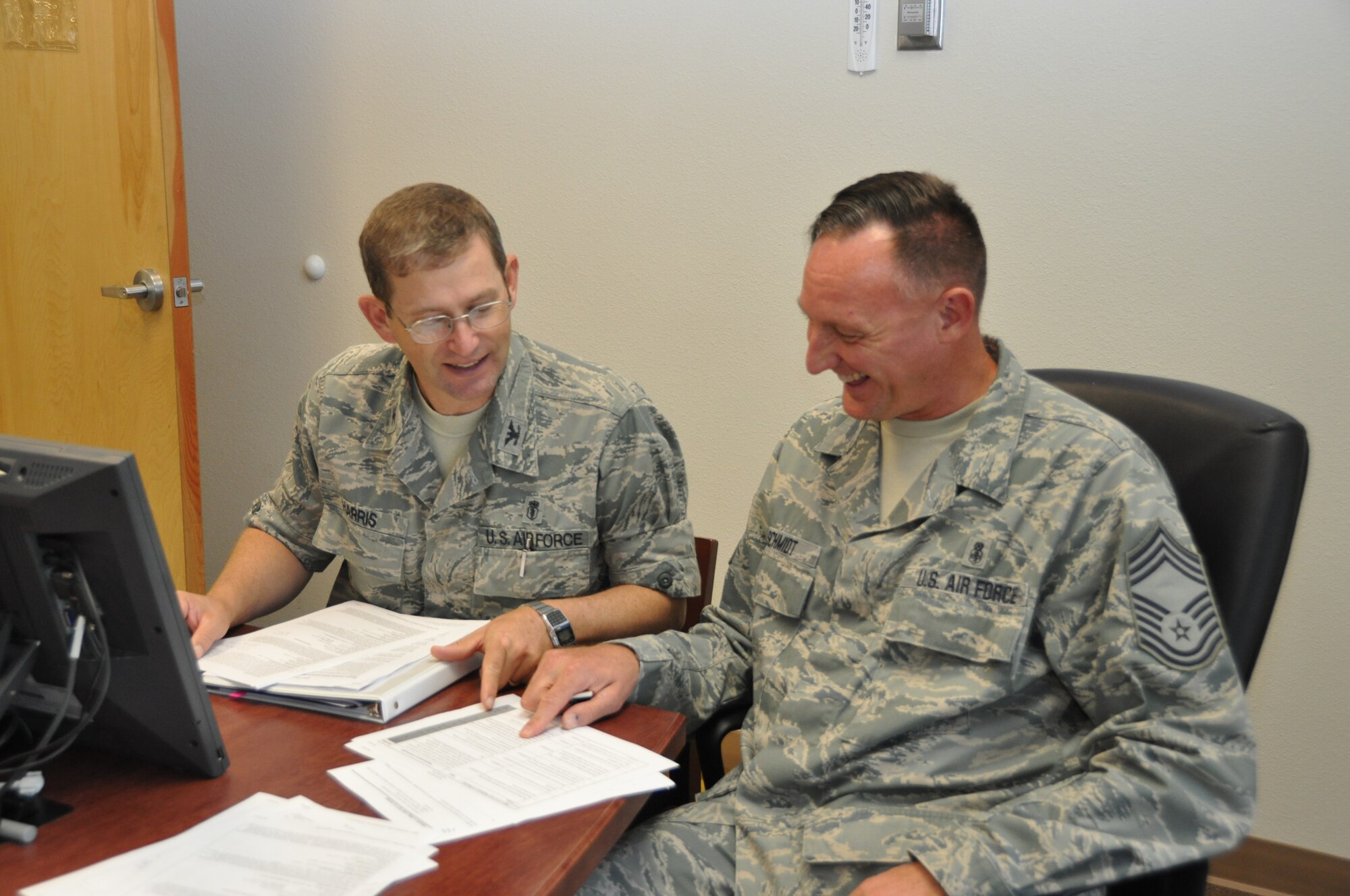 Col. (Dr.) Lynn “Chad” Harris, new 81st Dental Squadron commander, and Chief Master Sgt. Gregory Schmidt, 81st DS superintendent, review documentation Sept. 11, 2012, at Keesler Air Force Base, Miss., as the unit prepares for the Health Service Inspection by the Air Force Inspection Agency scheduled for Oct. 23-25 and AETC Consolidated Unit Inspection the following week .  The colonel assumed command during an Aug. 9 ceremony.  Harris succeeded Col. (Dr.) Nicholas Miniotis who was honored during a May 10 retirement ceremony for his 30 years of Air Force service.  He is now an assistant professor at the Louisiana State University School of Dentistry.  (U.S. Air Force photo by Steve Pivnick)
