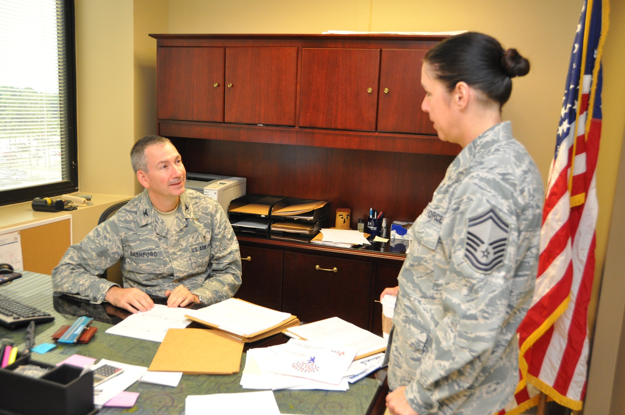 Col. (Dr.) Michael Bashford, new 81st Surgical Operations Squadron commander, discusses staff scheduling with squadron superintendent Senior Master Sgt. Paula Eischen Sept. 11, 2012, at the Keesler Hospital, Keesler Air Force Base, Miss.  Bashford succeeded Col. (Dr.) Joseph Giovannini during an Aug. 16  change of command ceremony.  Prior to assuming command, Bashford was the 81st Medical Operations Squadron Genetics Flight commander and director of the USAF Medical Genetics Center at Keesler AFB.  (U.S. Air Force photo by Steve Pivnick)