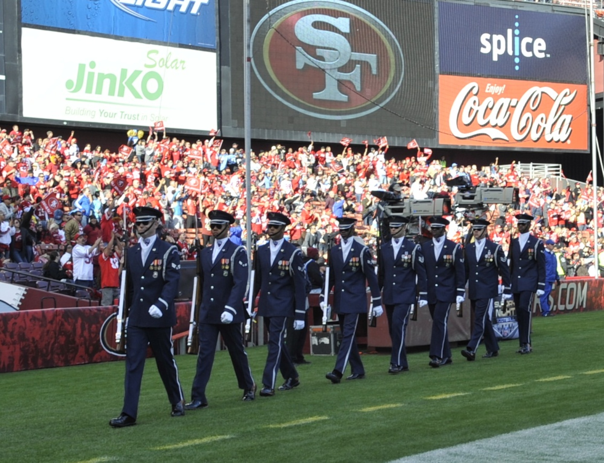U.S. Air Force Honor Guard Drill Team members walk on the field at the Detroit Lions vs. San Francisco 49ers NFL football game at Candlestick Park in San Francisco, Calif., Sept. 16, 2012.  The Drill Team performed in front of more than 500 people during a pre-game drill and stood on the field during the National Anthem in front of a sold-out crowd.  (U.S. Air Force photo by Senior Master Sgt. Adam M. Stump)