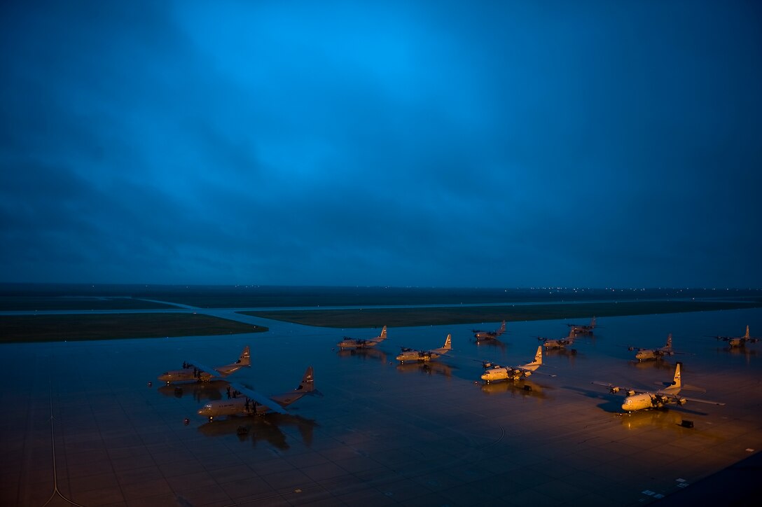 C-130J Super Hercules from the 317th Airlift Group weather a storm Sept. 18, 2012, at Dyess Air Force Base, Texas. Dyess recently received its 23rd of 28 C-130Js. The C-130J is the newest generation of the C-130 Hercules which primarily performs the tactical portion of the airlift mission. The aircraft is capable of operating from rough, dirt strips and is the prime transport for air dropping troops and equipment into hostile areas. Once the final aircraft is delivered, Dyess will be home to the largest C-130J fleet in the world. (U.S. Air Force photo by Airman 1st Class Damon Kasberg/ Released)