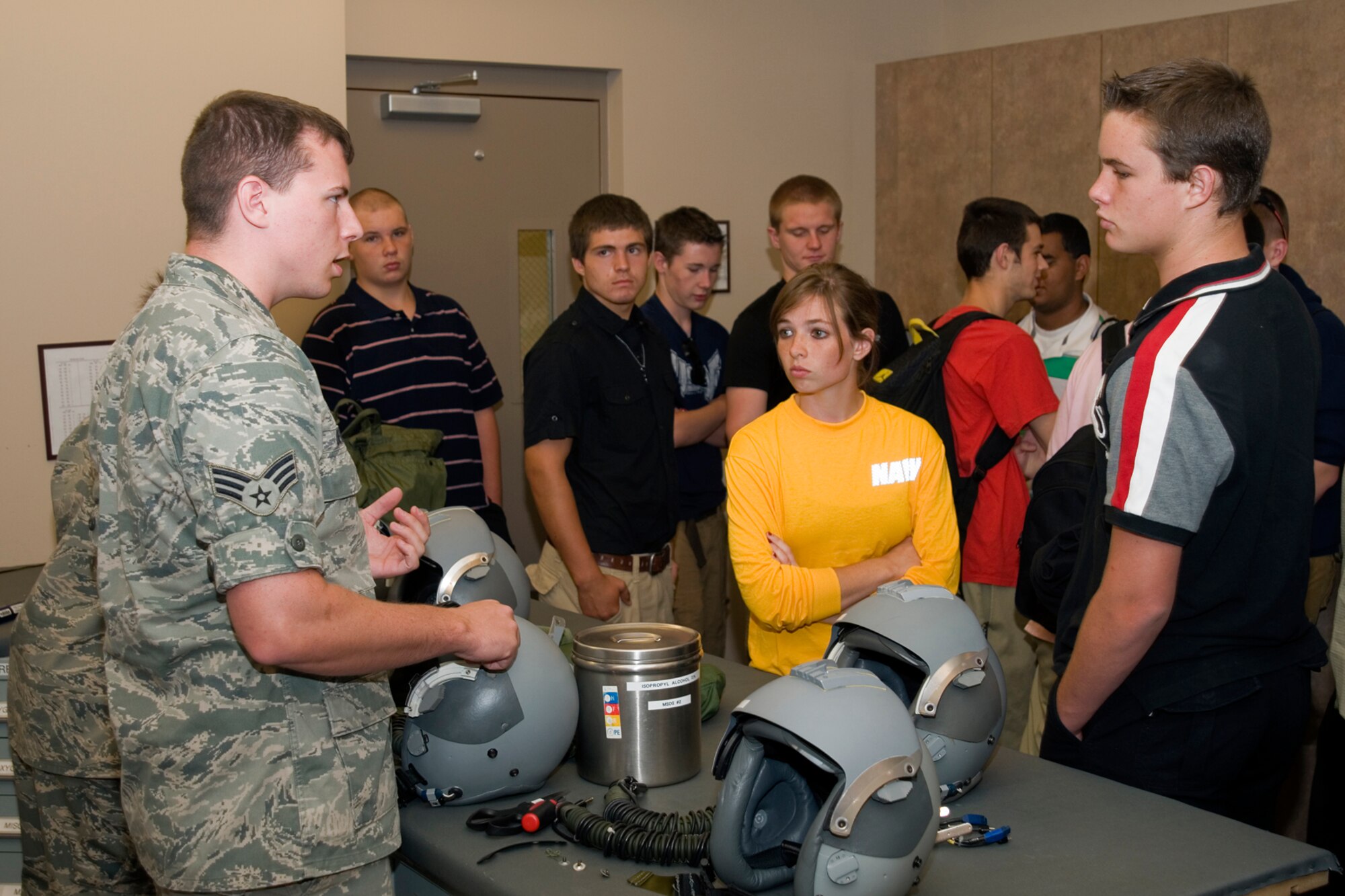 GRISSOM AIR RESERVE BASE, Ind. -- Senior Airmen Matthew Devers, 434th Operations Support Squadron aircrew flight equipment apprentice, shows students from Anderson High School, Anderson, Ind., how aircrew helmets are maintained during a base tour. Navy Junior ROTC students from Anderson visited the base to learn more about the military and the 434th Air Refueling Wing. (U.S. Air Force photo/Senior Airman Andrew McLaughlin) 
