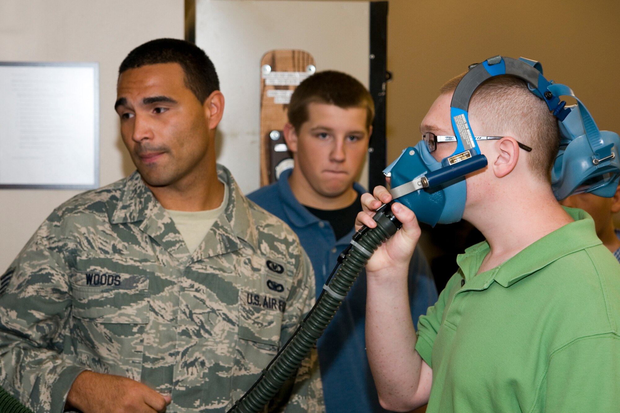 GRISSOM AIR RESERVE BASE, Ind. -- Staff Sgt. Lamar Woods, 434th Operations Support Squadron aircrew flight equipment apprentice, shows a student from Anderson High School, Anderson, Ind., how aircrew oxygen masks are tested for operational safety during a base tour. Navy Junior ROTC students from Anderson visited the base to learn more about the military and the 434th Air Refueling Wing. (U.S. Air Force photo/Senior Airman Andrew McLaughlin)
