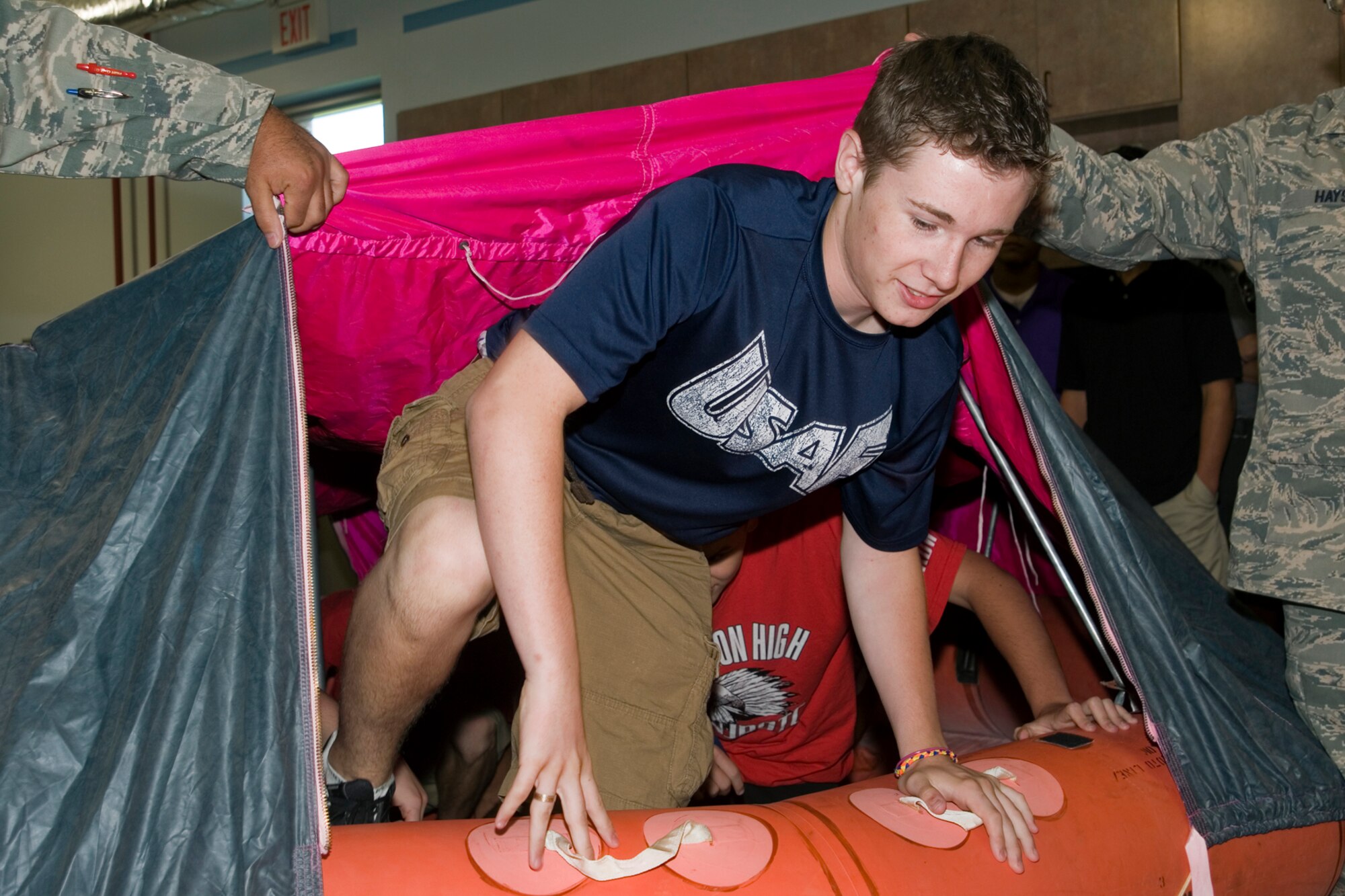 GRISSOM AIR RESERVE BASE, Ind. -- Slade Webb, a student at Anderson High School, Anderson, Ind., climbs out of an emergency survival raft at the aircrew flight equipment section during a base tour. Navy Junior ROTC students from Anderson visited the base to learn more about the military and the 434th Air Refueling Wing. (U.S. Air Force photo/Senior Airman Andrew McLaughlin)
