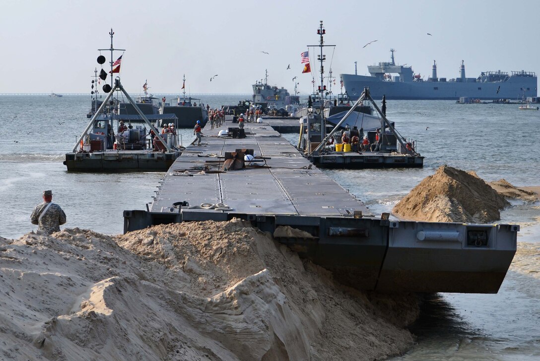 The Trident pier rests on the shore of Fort Story, Va., after ‘stabbing the beach’ during the preliminary stages of Joint Logistics-Over-the-Shore exercise, Aug.17, 2012. (Courtesy photo