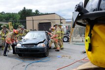HANSCOM AIR FORCE BASE, Mass. – Hanscom firefighters use the “jaws of life” during a simulated motor vehicle accident in the civil engineering compound Sept. 10. The Hanscom Fire Department participates in exercises such as these to be better prepared for real world situations. (U.S. Air Force photo by Linda LaBonte Britt)