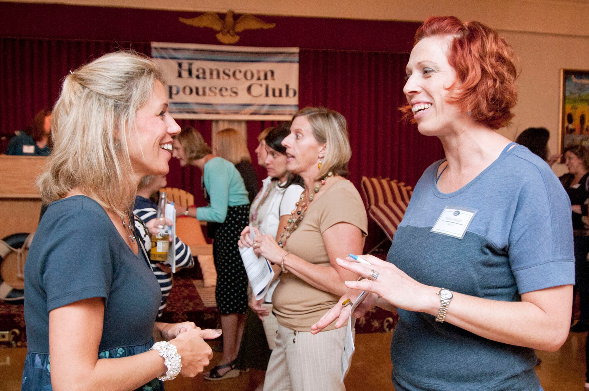 HANSCOM AIR FORCE BASE, Mass. - Cindy Canavan (left) and Melissa Stiefel play a game intended to introduce spouses to one another at the Hanscom Spouses Club Welcome at the Minuteman Commons Sept. 14. Spouses were invited to attend the social to learn more about the club’s social groups and events. (U.S. Air Force photo by Mark Wyatt)