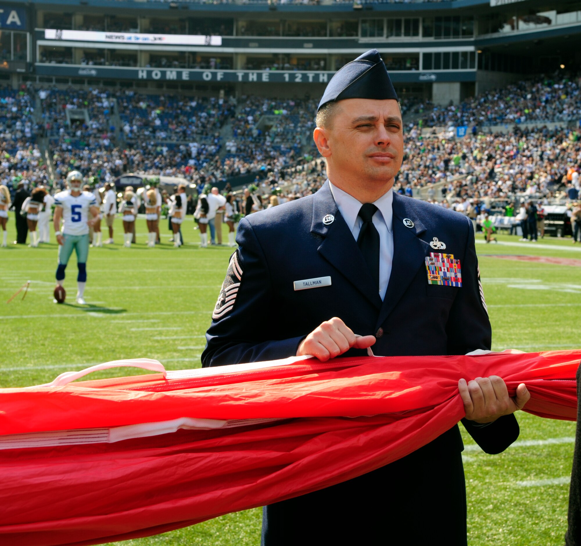 Senior Master Sgt. Richard Tallman, 62nd Maintenance Group quality assurance chief, prepares for the unfurling of the U.S. flag for the pregame ceremonies at the Sept. 16, 2012 Seattle Seahawks home opener against the Dallas Cowboys at Century Link field in Seattle, Wash. Tallman volunteered to lead the 32 active and Reserve servicemembers in the ceremony as they represented the U.S. Air Force.   (U.S. Air Force photo/Master Sgt. Todd Wivell)