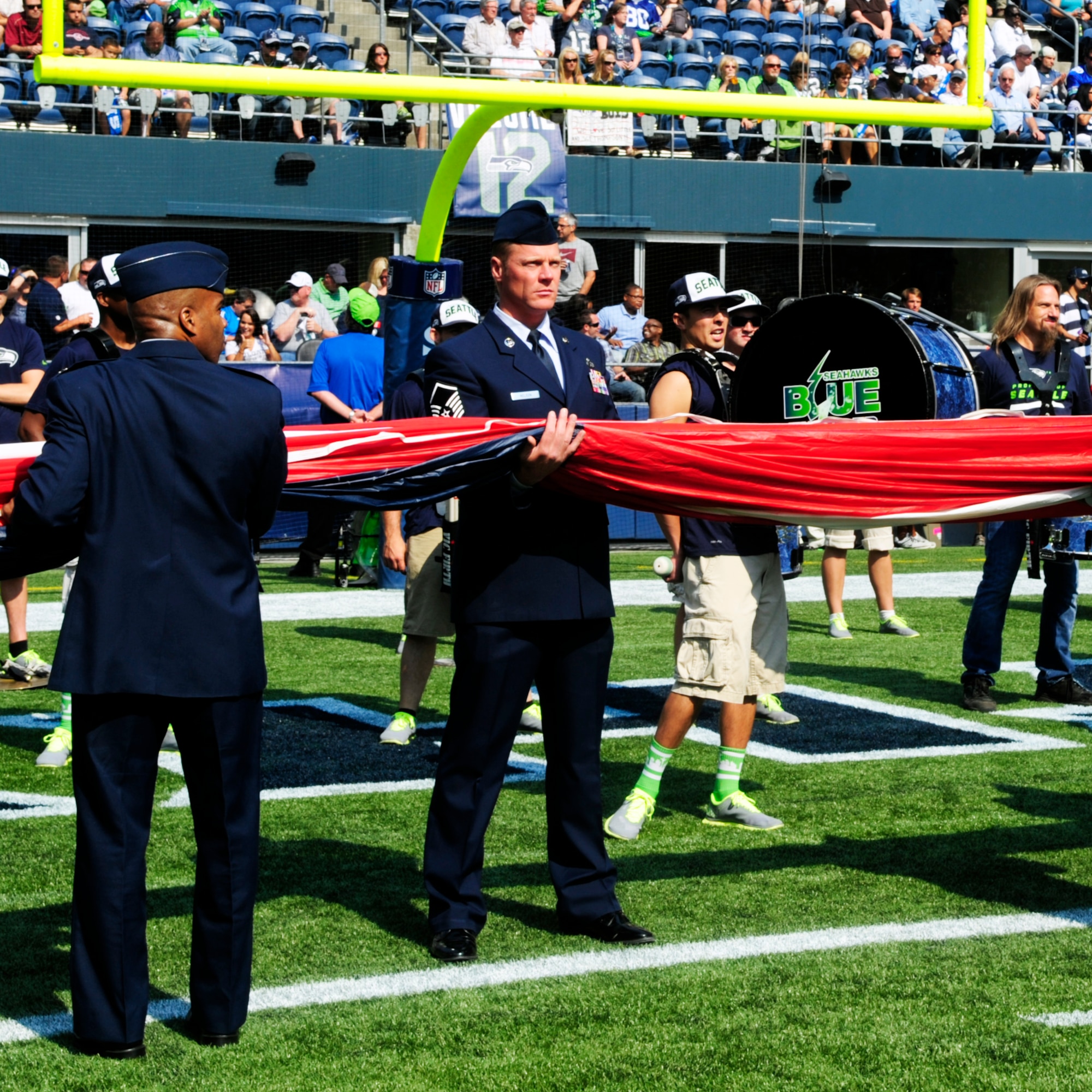 Master Sgt. Brad Nelson, 62nd Airlift Wing Plans and Programs, prepares for the unfurling of the U.S. flag for the pregame ceremonies at the Sept. 16, 2012 Seattle Seahawks home opener against the Dallas Cowboys at Century Link field in Seattle, Wash. Nelson was one of 22 servicemembers from the 62nd AW who volunteered to participate in the opening ceremonies. (U.S. Air Force photo/Master Sgt. Todd Wivell)