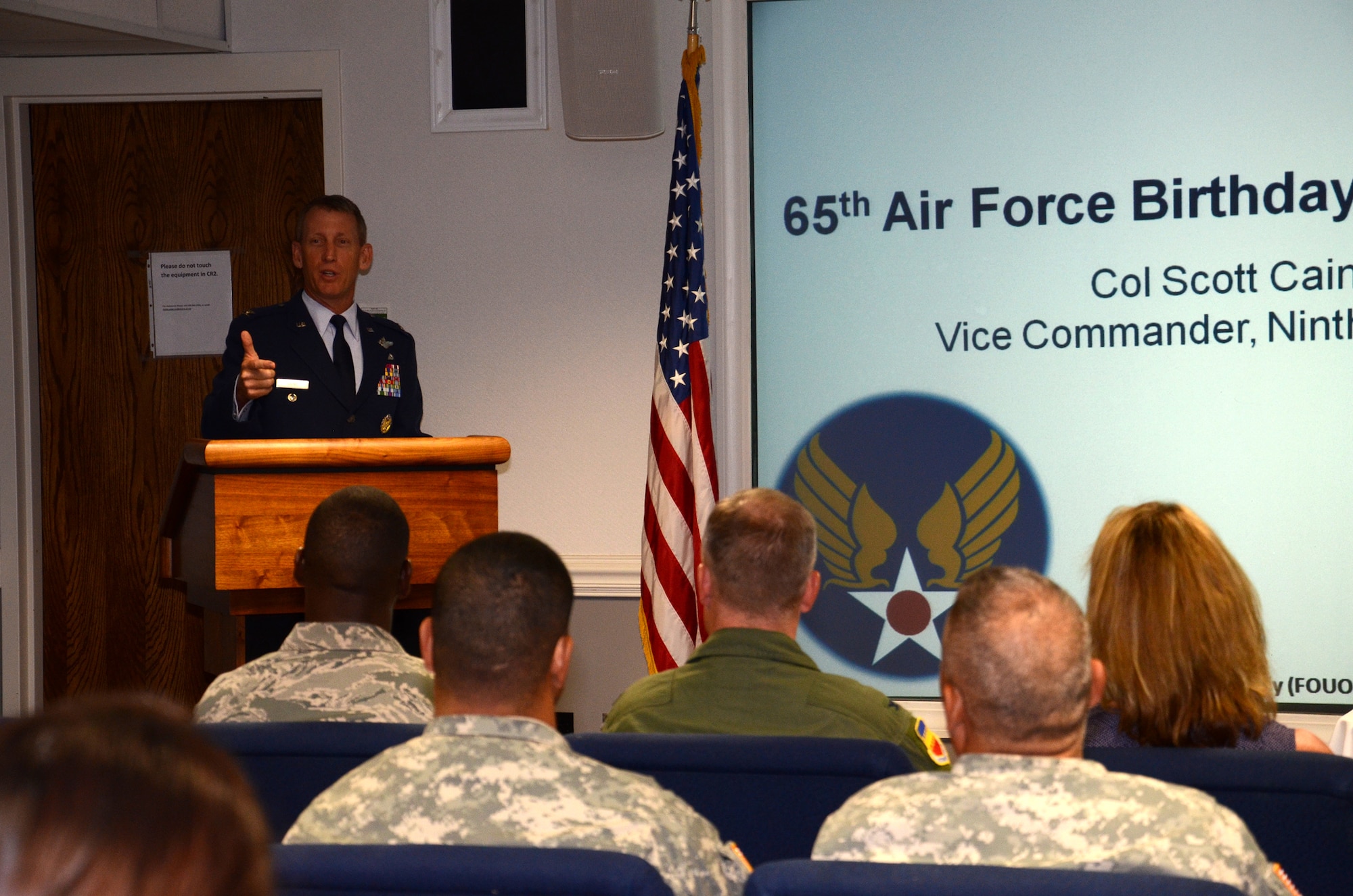The 9th Air Force vice commander, Col. Scott Caine, speaks to a crowd about Air Force history during a celebration for the Air Force’s 65th birthday, Sept. 18, 2012, at Shaw Air Force Base, S.C. After the colonel’s speech, celebration guests enjoyed birthday cake. U.S. Army Central Command Soldiers stationed at Shaw AFB also attended the celebration to pay tribute to their sister service. (U.S. Air Force photo by Staff Sgt. Amanda Currier/Released)